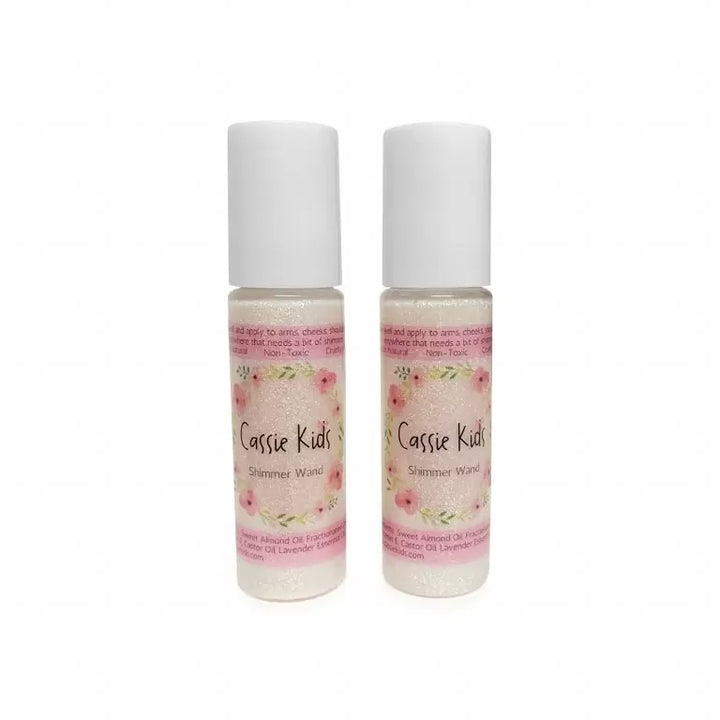 Two bottles of Cassie Kids Shimmer Wash on a white background