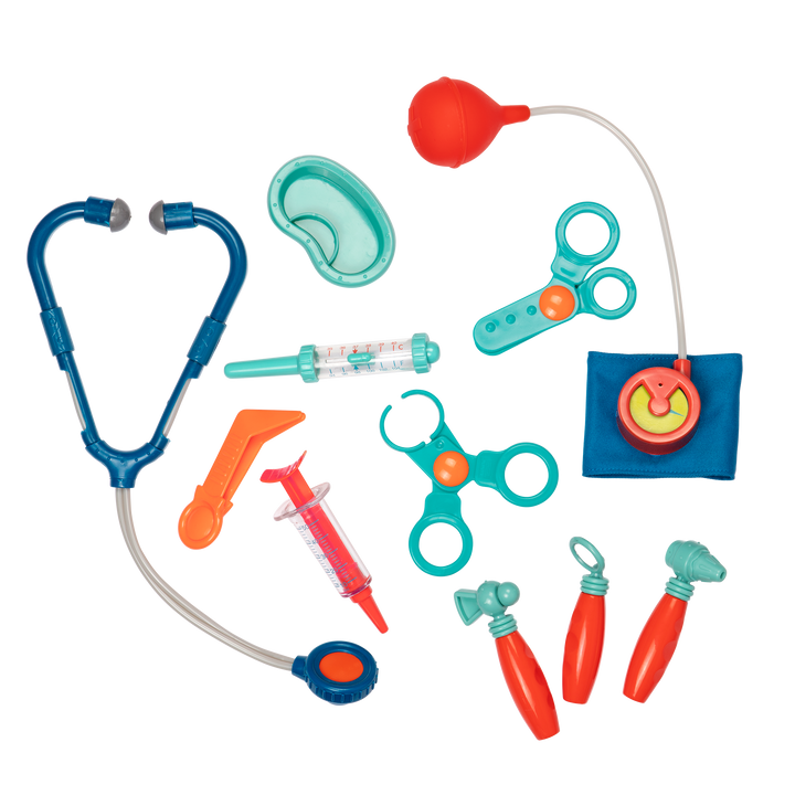 Colorful toy medical set with stethoscope, syringes, and other tools on a white background