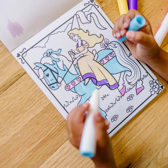 Child coloring a picture of a princess and horse with markers on a wooden table.