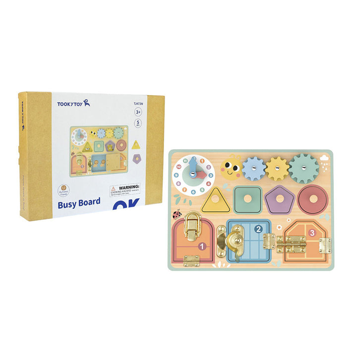 Wooden busy board with locks and shapes next to its packaging on a white background