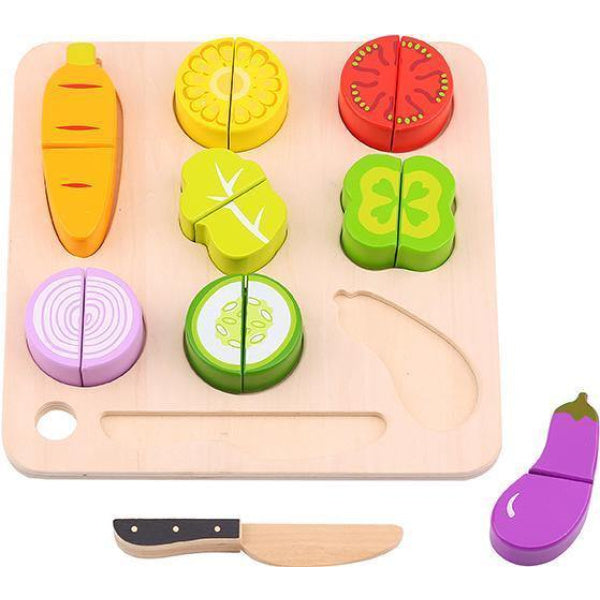 Wooden toy cutting board with colorful vegetable shapes and a knife on a white background